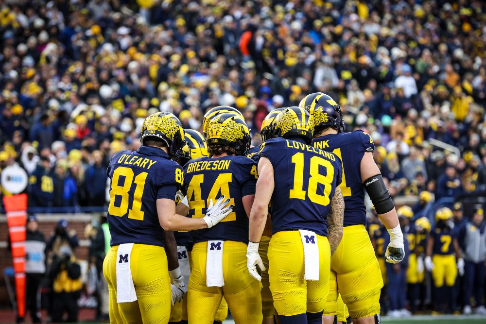 Michigan Wolverines football team entering Michigan Stadium The Big House
